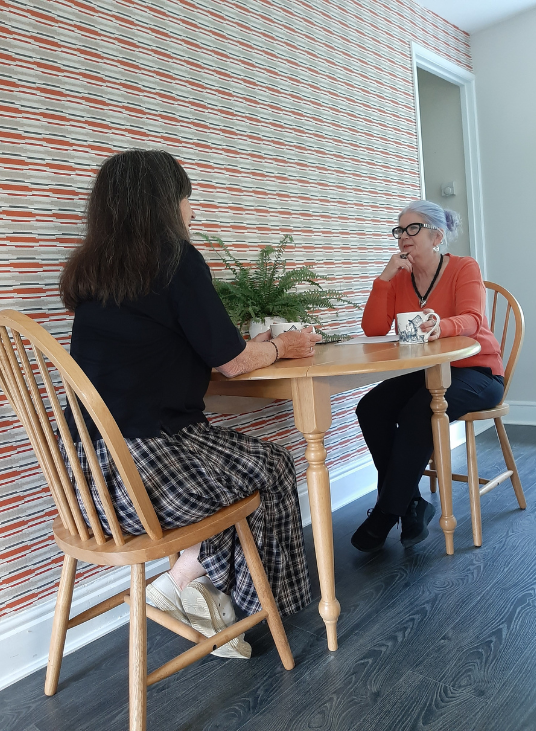 Lorraine McReight and Manya at the table