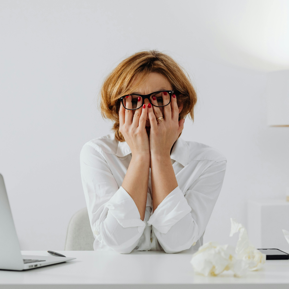 Upset woman at her desk