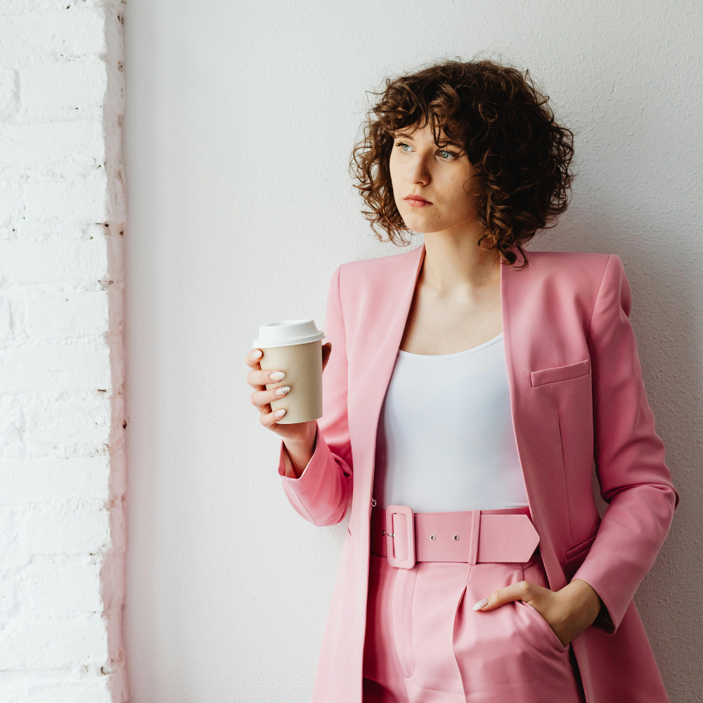 Woman in a pink suit
