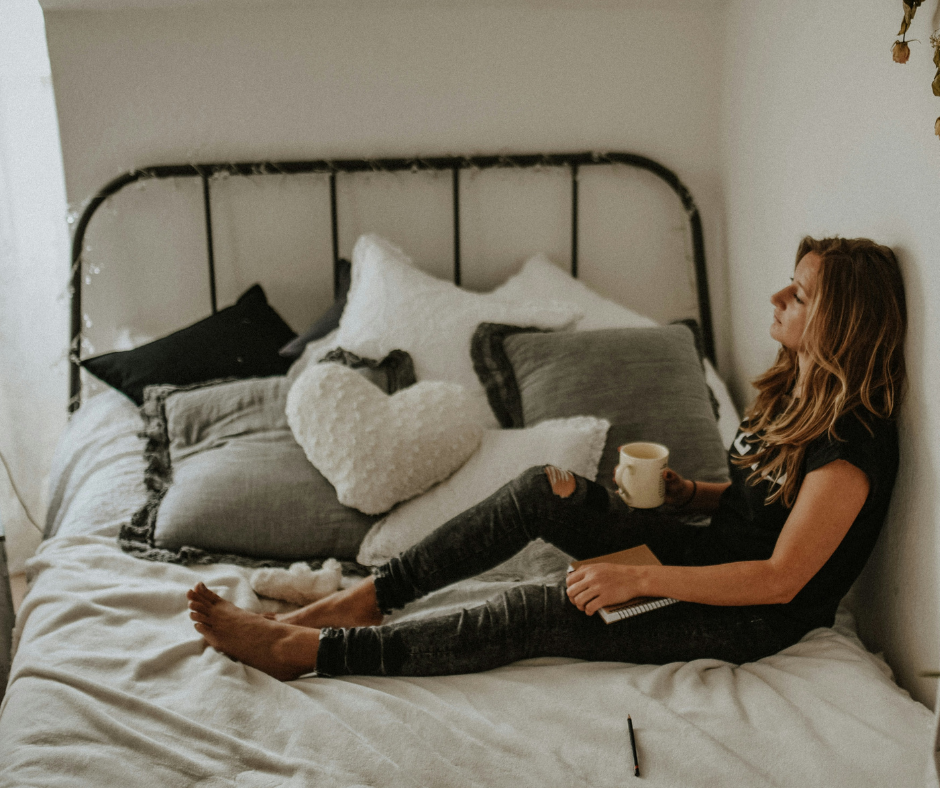 Woman lying on bed